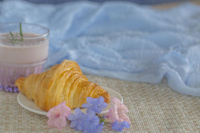 Close-up of purple flower on table