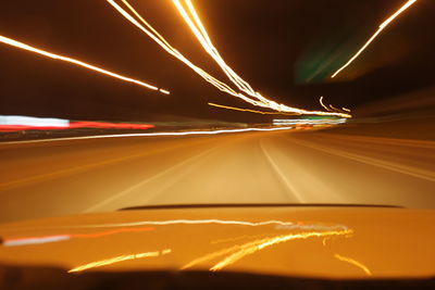 Light trails on road at night