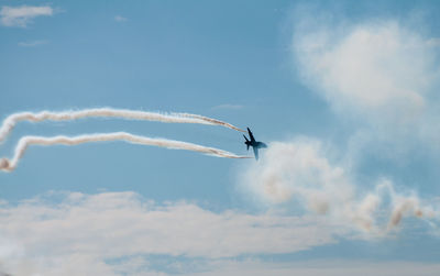 Low angle view of airplane against the sky