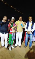 Full length portrait of friends standing outdoors