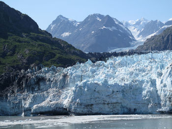 Scenic view of sea against mountain range