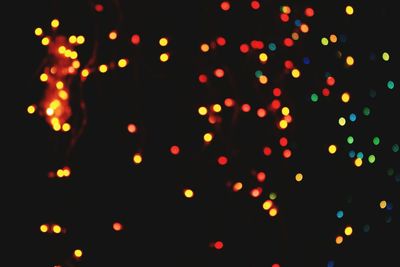 Defocused image of illuminated lights at night