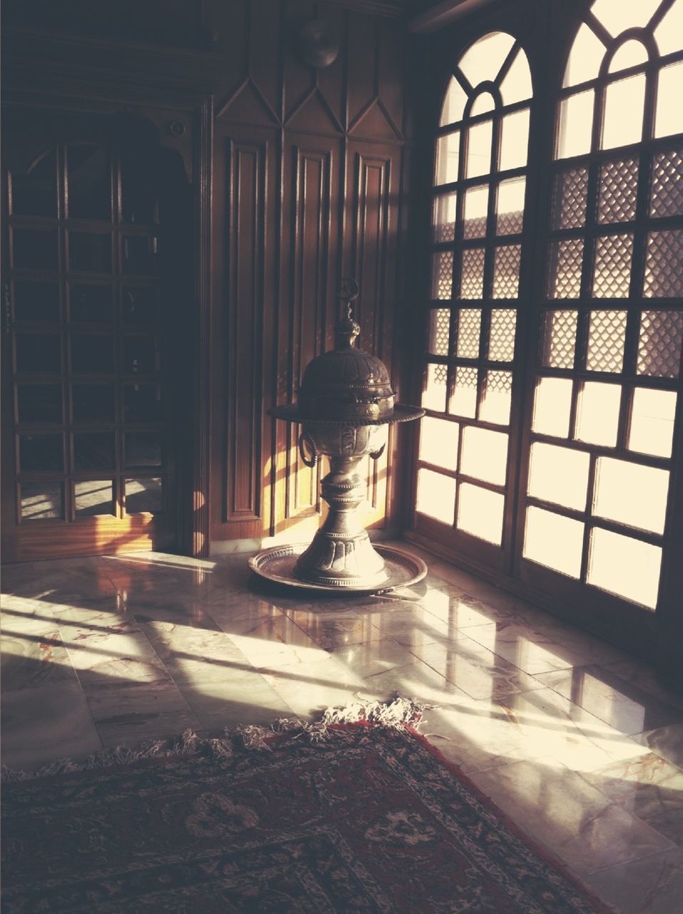 indoors, architecture, built structure, window, architectural column, glass - material, sunlight, lighting equipment, empty, interior, illuminated, no people, day, absence, flooring, transparent, reflection, shadow, ceiling, religion