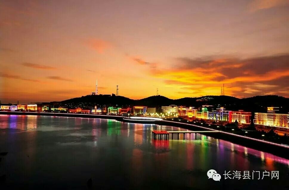 architecture, water, built structure, illuminated, sunset, building exterior, sky, river, reflection, waterfront, city, cloud - sky, transportation, bridge - man made structure, connection, dusk, orange color, bridge, cloud, nautical vessel