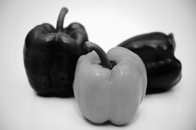 Close-up of fruits on table against white background