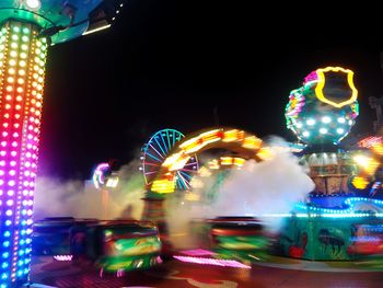 Illuminated ferris wheel at night