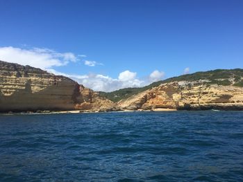 Scenic view of sea against blue sky