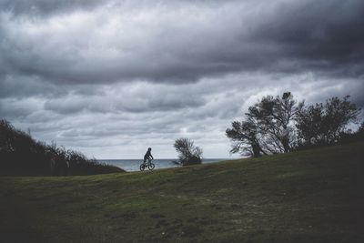 People on field against sky