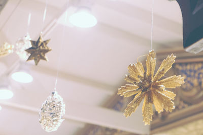 Close-up of christmas decoration hanging on ceiling