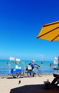 Scenic view of sea against clear blue sky