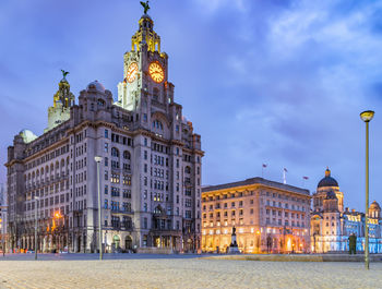 Buildings in city at dusk