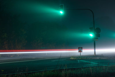 Empty road against sky at night