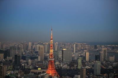 Illuminated buildings in city at night, urban skyline at tokyo with tokyo tower