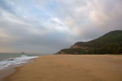 Scenic view of beach and sea against sky