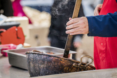 Midsection of chef preparing food