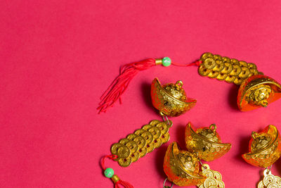 Close-up of chinese new year decorations on pink background