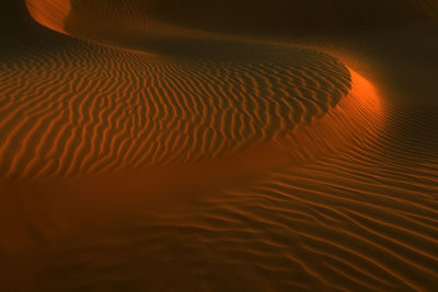 Full frame shot of sand dune at desert during sunset
