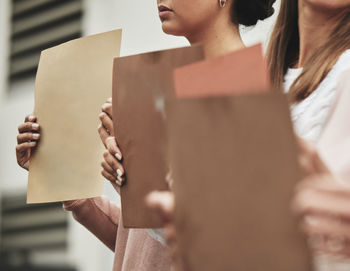 Midsection of business colleagues working in office