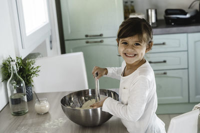 Portrait of smiling woman at home