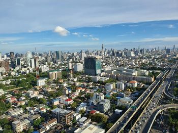 High angle view of modern buildings in city against sky