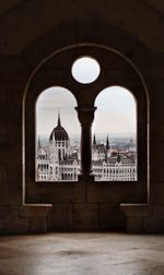 View of historic building seen through arch