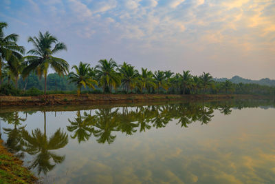 Scenic view of lake against sky during sunset