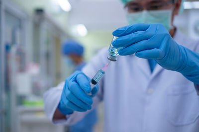Close-up of human hand holding umbrella