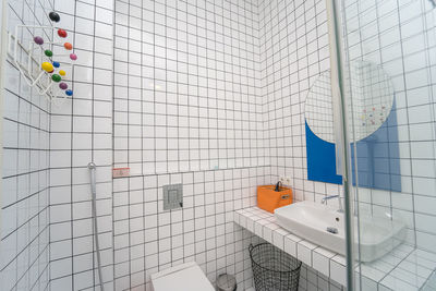 Empty tiled wall bathroom