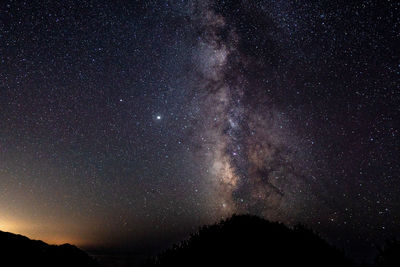 Low angle view of stars in sky at night