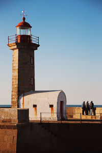 Lighthouse against clear blue sky