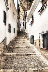 Narrow alley amidst buildings in town