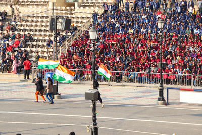 People on street against buildings