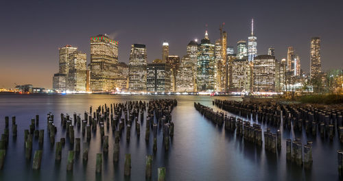 Illuminated modern buildings in city at night