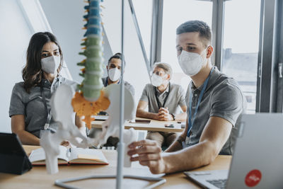 Group of people working on table