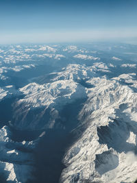 Aerial view of snow capped mountain range