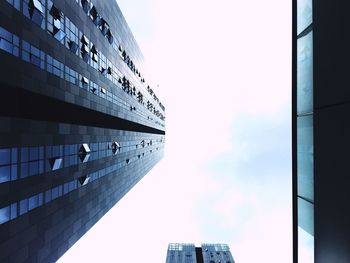 Low angle view of modern buildings against sky