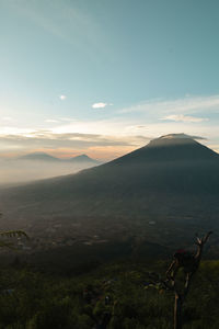 Scenic view of mountains against sky during sunset