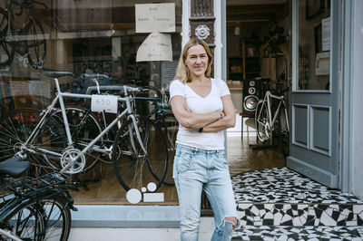 Portrait of smiling young woman on bicycle