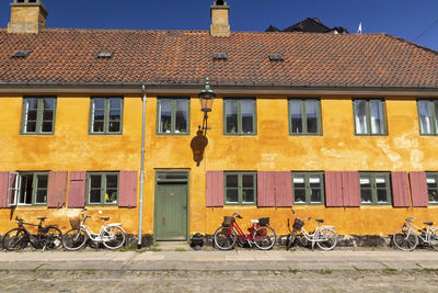 Bicycles on street against buildings