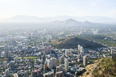 High angle view of city buildings against sky