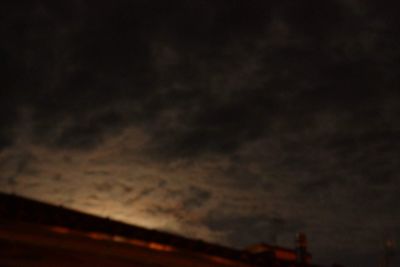 Low angle view of dramatic sky at night