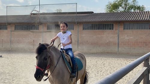 Woman riding horse