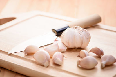 Close-up of eggs in container on cutting board