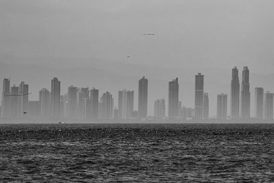 Skyline of panama city in a cloudy day seen from the water