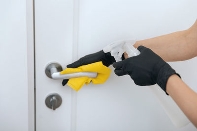 Cropped hand of man holding equipment