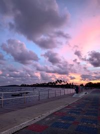 Scenic view of beach against dramatic sky