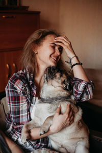 Mid adult woman sitting at home