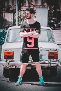 Full length of man standing on street in city