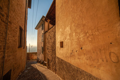 Empty alley amidst buildings