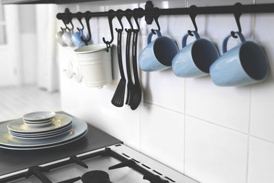 Utensils hanging on rack